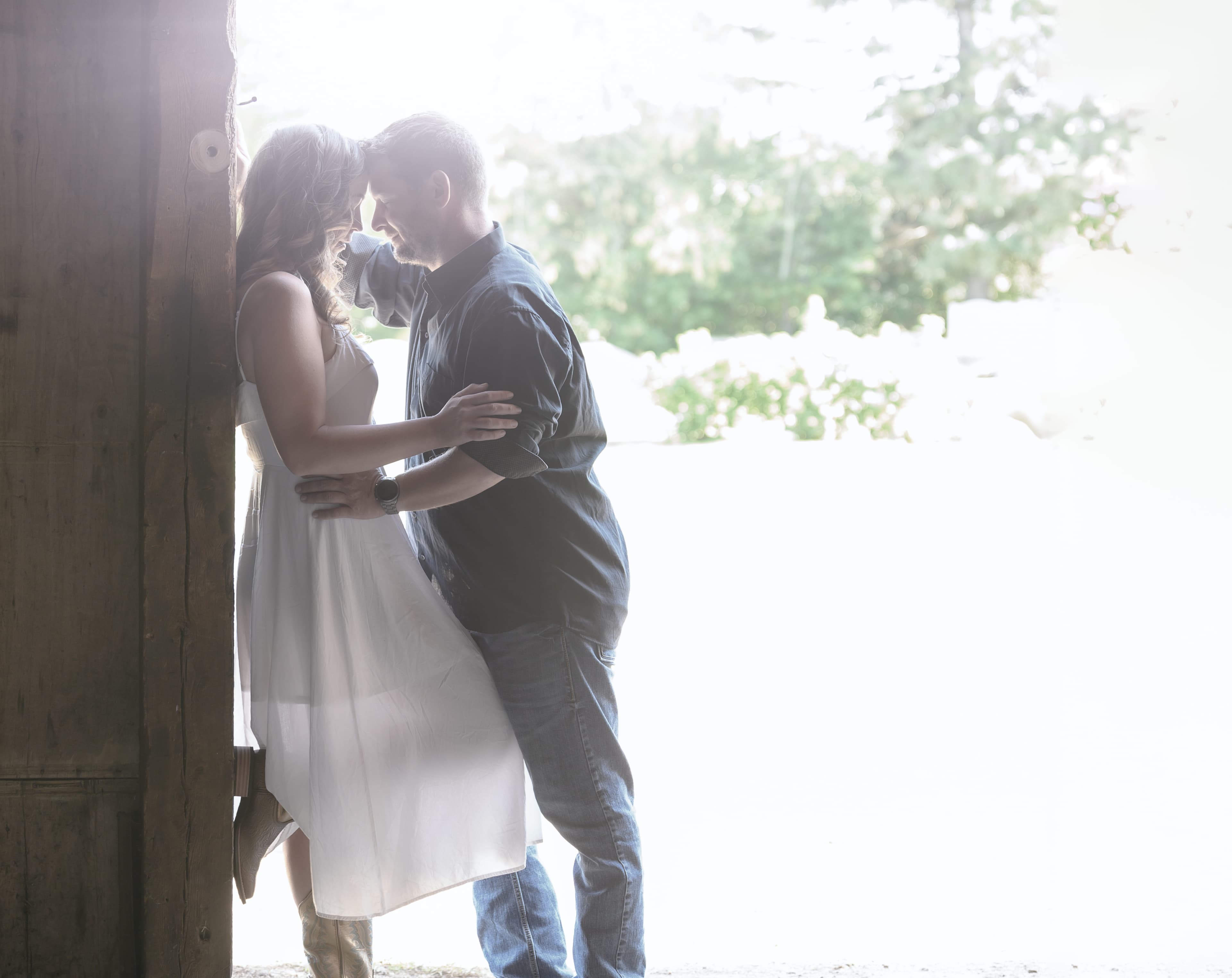 Couple photographed together in soft barn light